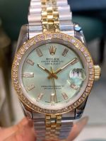 Rolex Datejust 31mm Baguette Diamond Bezel Two-tone Gold Band Mint Green Face Lady Watch